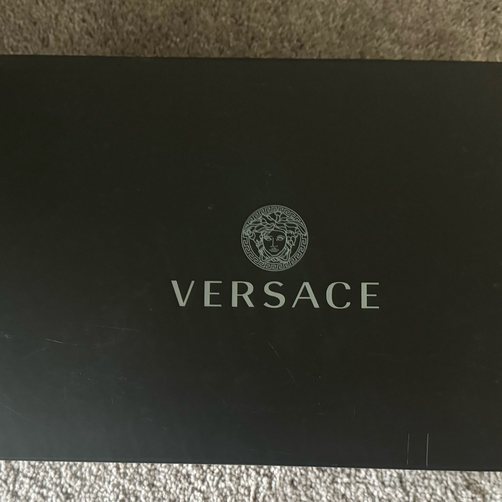 black versace slides in box never worn